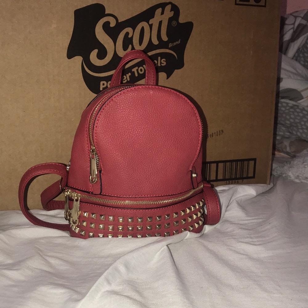 Mini backpack with three pockets